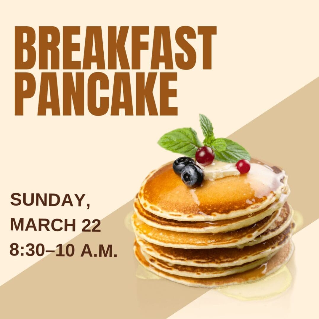 Stack of pancakes with berries and syrup